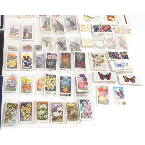 2304 - Collection of cigarette cards and tea cards, some arranged in albums, including a set of fifty John ... 