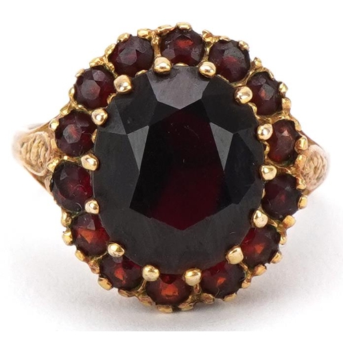 3129 - 9ct gold garnet cluster ring, resized to size J, 5.8g