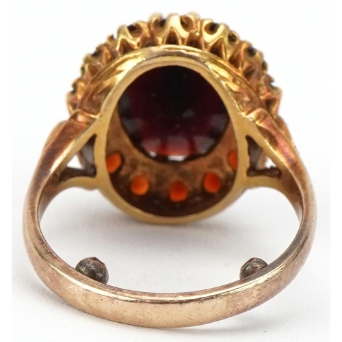 3129 - 9ct gold garnet cluster ring, resized to size J, 5.8g