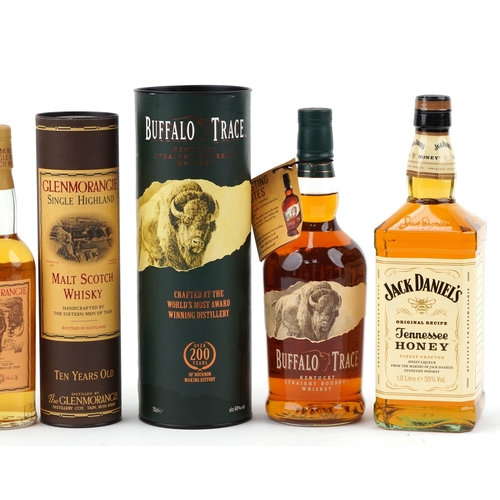 597 - Four bottles of whisky - Jack Daniels Gentleman Jack Tennessee whisky, Jack Daniels Honey Tennessee ... 