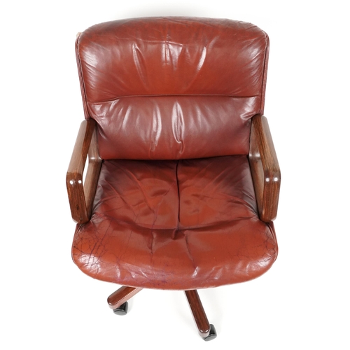 1053 - Vaghi mid century Italian laminated wood and oxblood leather desk chair, 95cm high