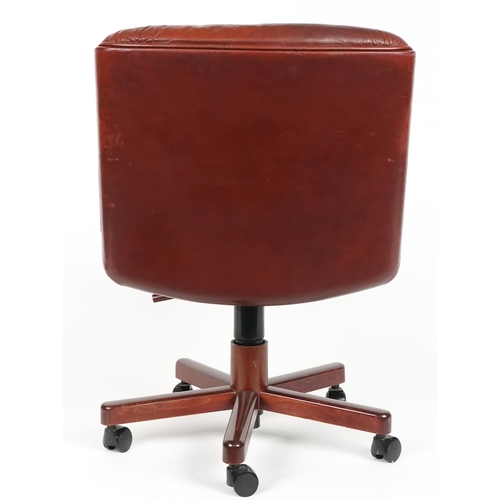 1053 - Vaghi mid century Italian laminated wood and oxblood leather desk chair, 95cm high