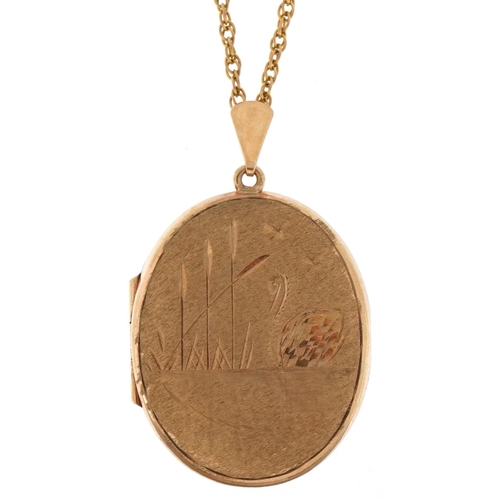 3021 - 9ct gold oval locket engraved with a swan on a lake on a 9ct gold multi link necklace, 4cm high and ... 