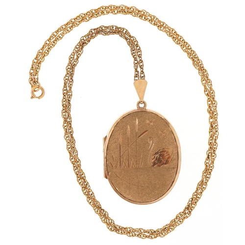 3021 - 9ct gold oval locket engraved with a swan on a lake on a 9ct gold multi link necklace, 4cm high and ... 