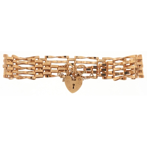 3016 - 9ct gold five row gate bracelet with love heart shaped padlock, 16cm in length, 7.3g