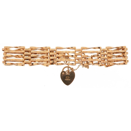 3016 - 9ct gold five row gate bracelet with love heart shaped padlock, 16cm in length, 7.3g