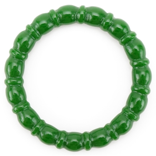 3096 - Chinese carved green stone bangle, 8cm in diameter, 44.7g