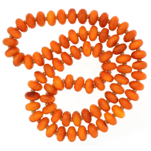 3242 - Butterscotch amber coloured bead necklace, each bead 14mm in diameter x 8mm deep, 70cm in length, 14... 