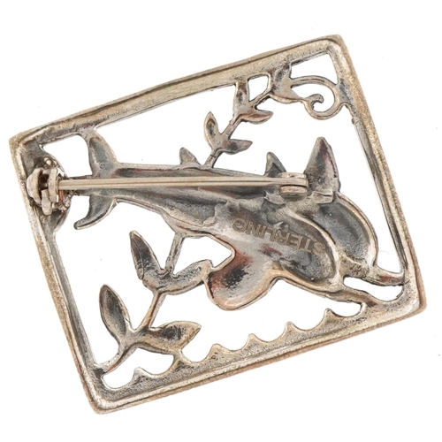 3223 - Modernist sterling silver brooch in the form of two leaping dolphins, 3.2cm wide, 9.8g