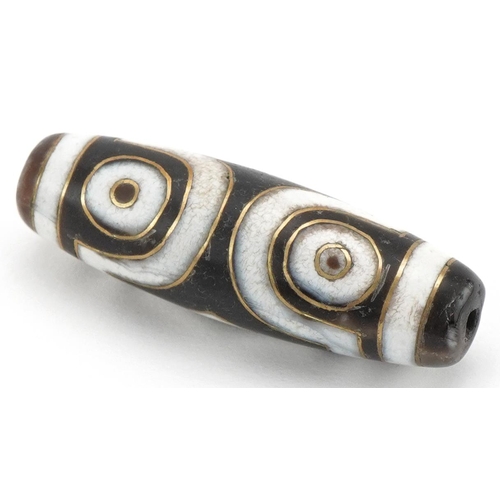 136 - Islamic agate bead with yellow metal inlay, 3.8cm in length, 8.4g