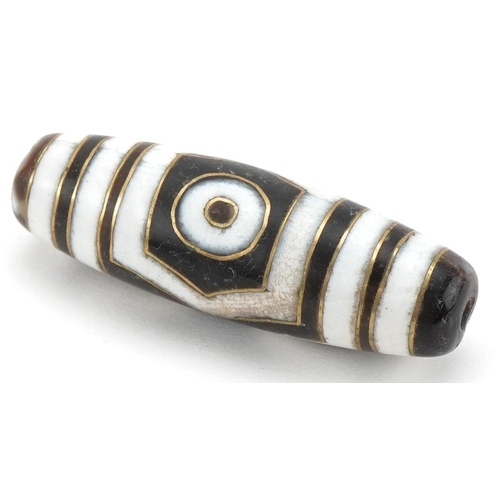 136 - Islamic agate bead with yellow metal inlay, 3.8cm in length, 8.4g