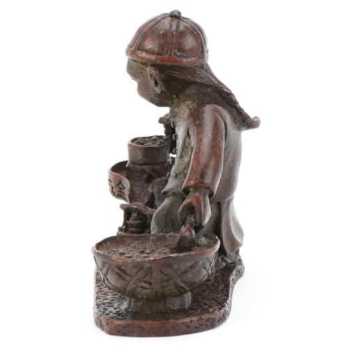 363 - Chinese patinated bronze study of a child street food seller, 7.5cm in length