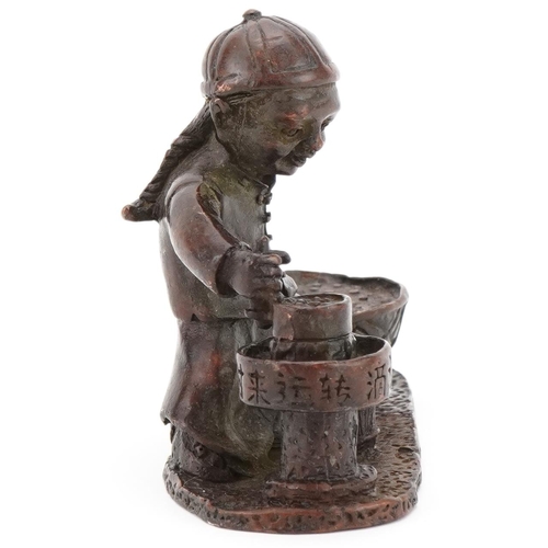 363 - Chinese patinated bronze study of a child street food seller, 7.5cm in length