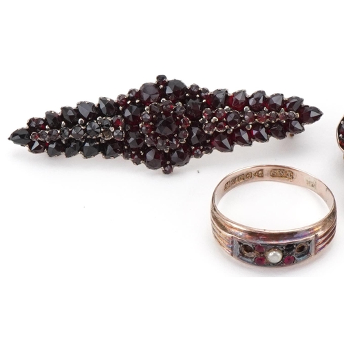 3281 - Two vintage Bohemian garnet brooches and a 9ct gold seed pearl and pink stone ring, size N, the ring... 