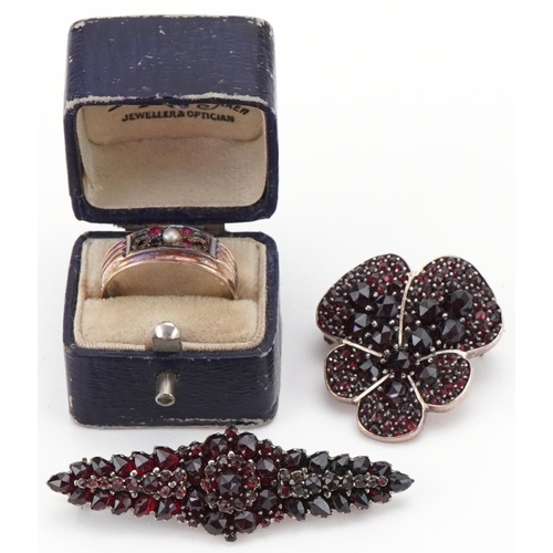 3281 - Two vintage Bohemian garnet brooches and a 9ct gold seed pearl and pink stone ring, size N, the ring... 