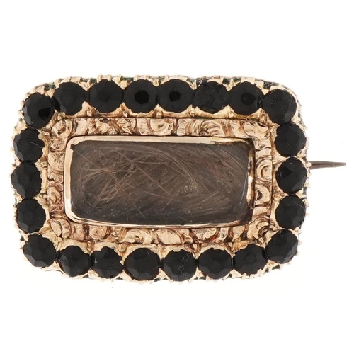 3012 - Georgian unmarked gold hairwork mourning brooch set with black stones, 2.1cm wide, 4.4g