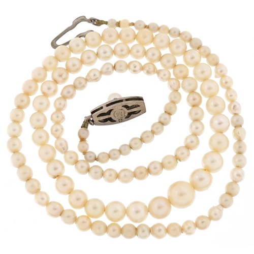 3153 - Mikimoto, Japanese graduated pearl necklace, the largest pearl 7.0mm in diameter, 55cm in length, 16... 