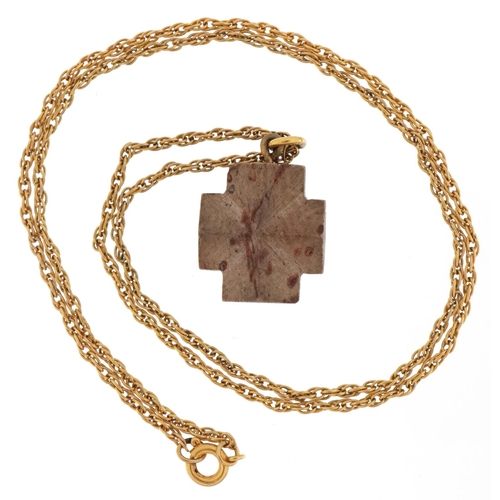 3328 - Petrified wood cross pendant on a yellow metal multi link necklace, 1.5cm high and 44cm in length, t... 