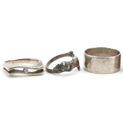 3333 - Six silver and white metal rings including an interlocking two piece ring and one in the form of a c... 