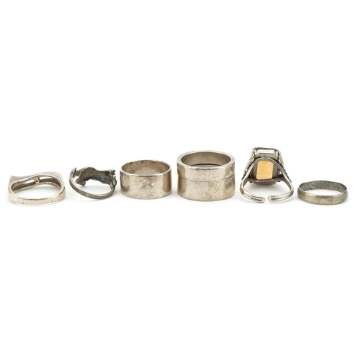 3333 - Six silver and white metal rings including an interlocking two piece ring and one in the form of a c... 