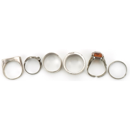 3333 - Six silver and white metal rings including an interlocking two piece ring and one in the form of a c... 