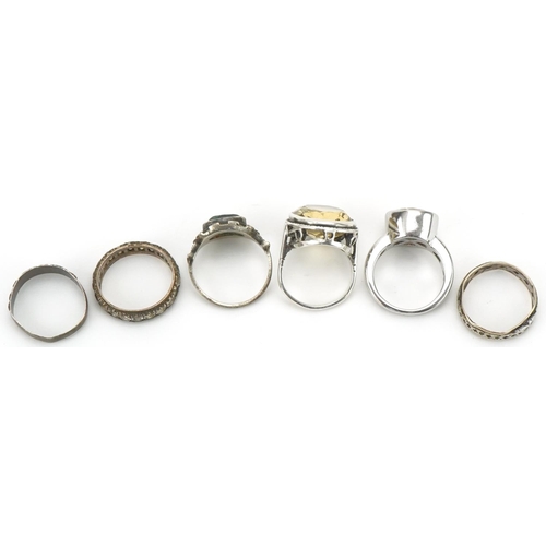 3286 - Six silver rings, some set with semi precious stones, including two eternity rings and a large citri... 