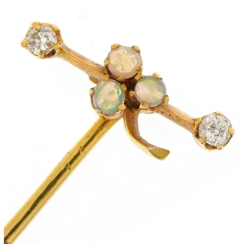 3066 - Unmarked gold opal and diamond stickpin set with three cabochon opals and two diamonds, 5.5cm in len... 