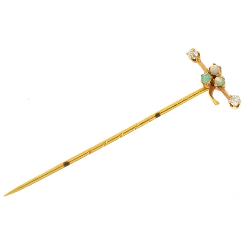 3066 - Unmarked gold opal and diamond stickpin set with three cabochon opals and two diamonds, 5.5cm in len... 