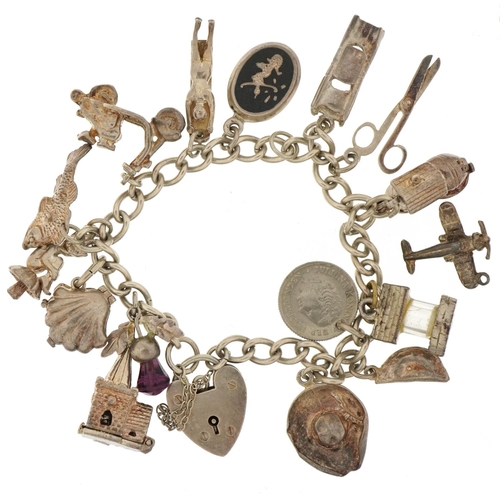 3116 - Silver charm bracelet with a selection of mostly silver charms and a colourful stone pendant on a si... 