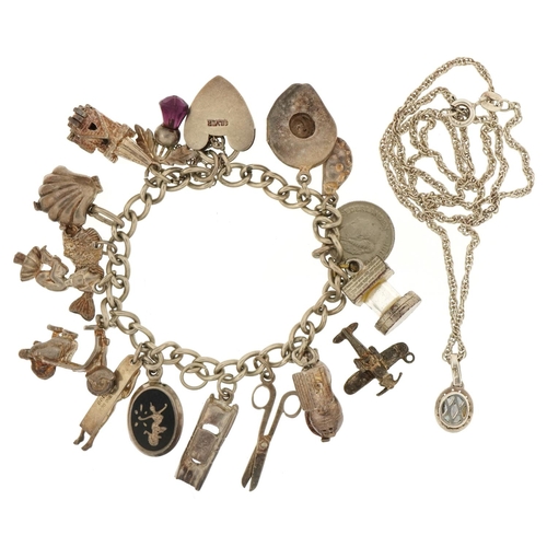 3116 - Silver charm bracelet with a selection of mostly silver charms and a colourful stone pendant on a si... 