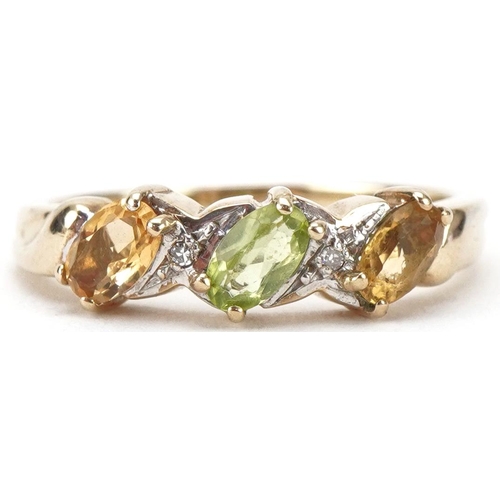 3157 - 9ct gold multi gem ring set with citrines, diamonds and a central green stone, size N, 2.6g