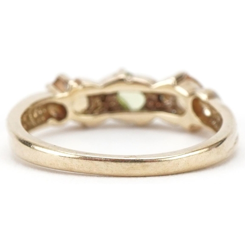 3157 - 9ct gold multi gem ring set with citrines, diamonds and a central green stone, size N, 2.6g