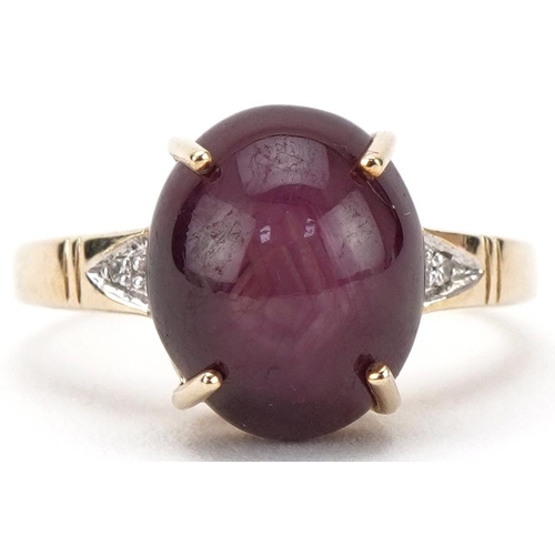 3161 - 9ct gold cabochon star ruby ring with diamond set shoulders, the ruby approximately 11.80mm x 9.90mm... 