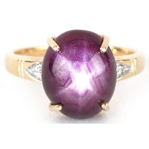 3161 - 9ct gold cabochon star ruby ring with diamond set shoulders, the ruby approximately 11.80mm x 9.90mm... 