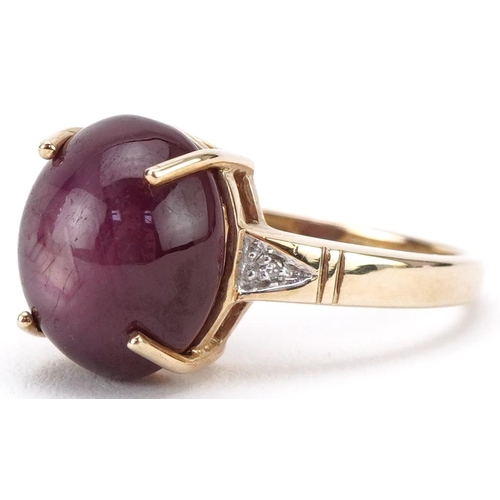 3161 - 9ct gold cabochon star ruby ring with diamond set shoulders, the ruby approximately 11.80mm x 9.90mm... 