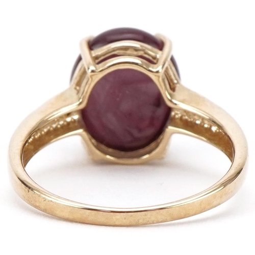 3161 - 9ct gold cabochon star ruby ring with diamond set shoulders, the ruby approximately 11.80mm x 9.90mm... 