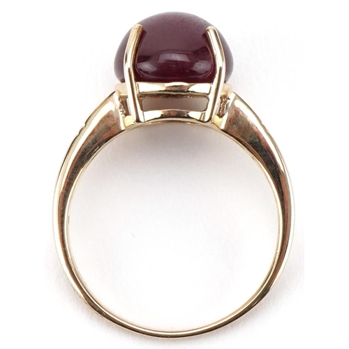 3161 - 9ct gold cabochon star ruby ring with diamond set shoulders, the ruby approximately 11.80mm x 9.90mm... 