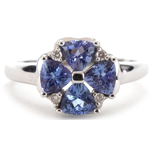 3266 - 9ct white gold tanzanite and diamond flower head ring, size O/P, 2.9g