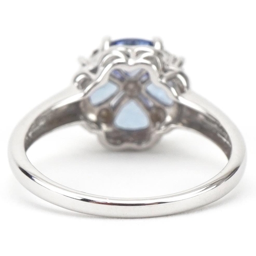 3266 - 9ct white gold tanzanite and diamond flower head ring, size O/P, 2.9g