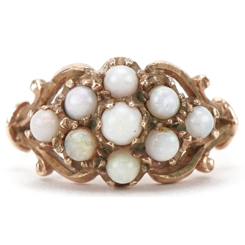 3210 - 9ct gold opal cluster ring with ornate settings, size L, 3.3g