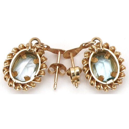 3072 - Pair of unmarked gold blue topaz drop earrings, 2.1cm high, total 2.3g