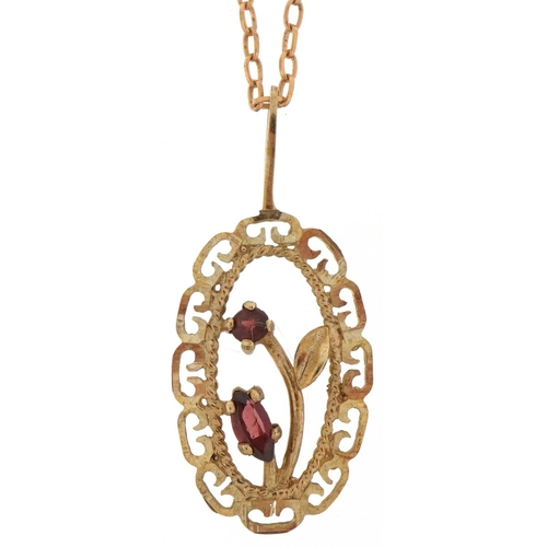 3100 - 9ct gold garnet floral pendant on a 9ct gold necklace, 2.6cm high and 38cm in length, total 1.8g