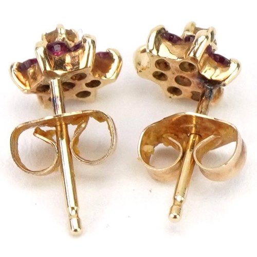 3188 - Pair of unmarked gold diamond and pink spinel flower head stud earrings, 5.5mm in diameter, 0.7g