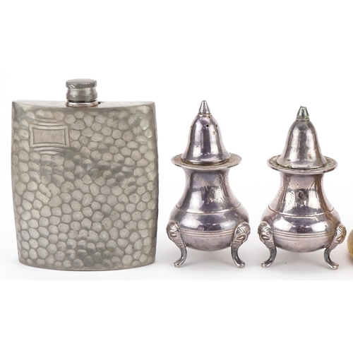 1234 - Four brass bell weights together with a pewter hip flask and a pair of plated salt and pepper shaker... 