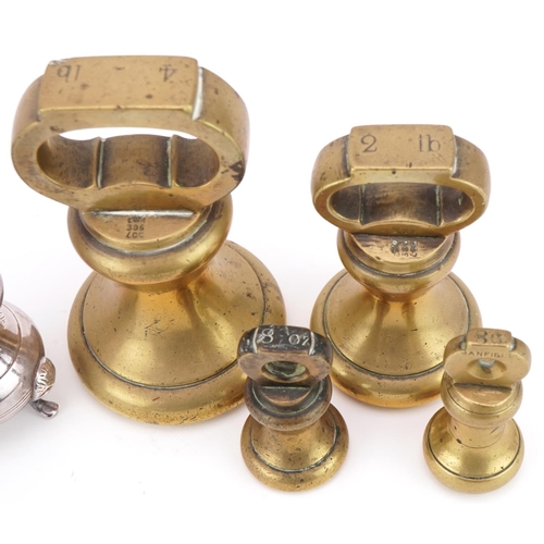 1234 - Four brass bell weights together with a pewter hip flask and a pair of plated salt and pepper shaker... 