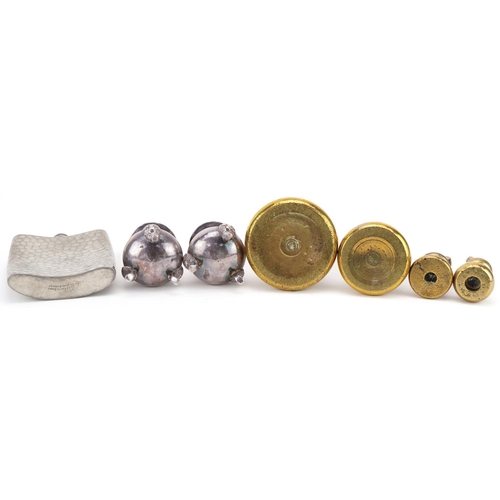 1234 - Four brass bell weights together with a pewter hip flask and a pair of plated salt and pepper shaker... 