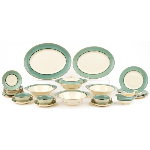 543 - Gray's Pottery part dinner service finished in green and gilt, the platter 41cm wide