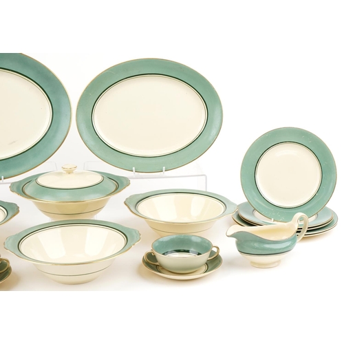 543 - Gray's Pottery part dinner service finished in green and gilt, the platter 41cm wide