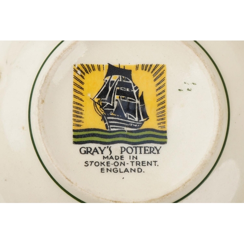 543 - Gray's Pottery part dinner service finished in green and gilt, the platter 41cm wide