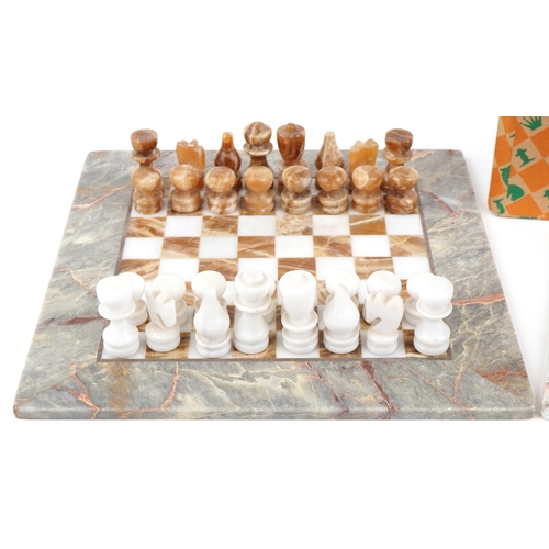 2025 - Mid to late 20th century marble chequer board together with two marble chess sets, the board 36cm x ... 